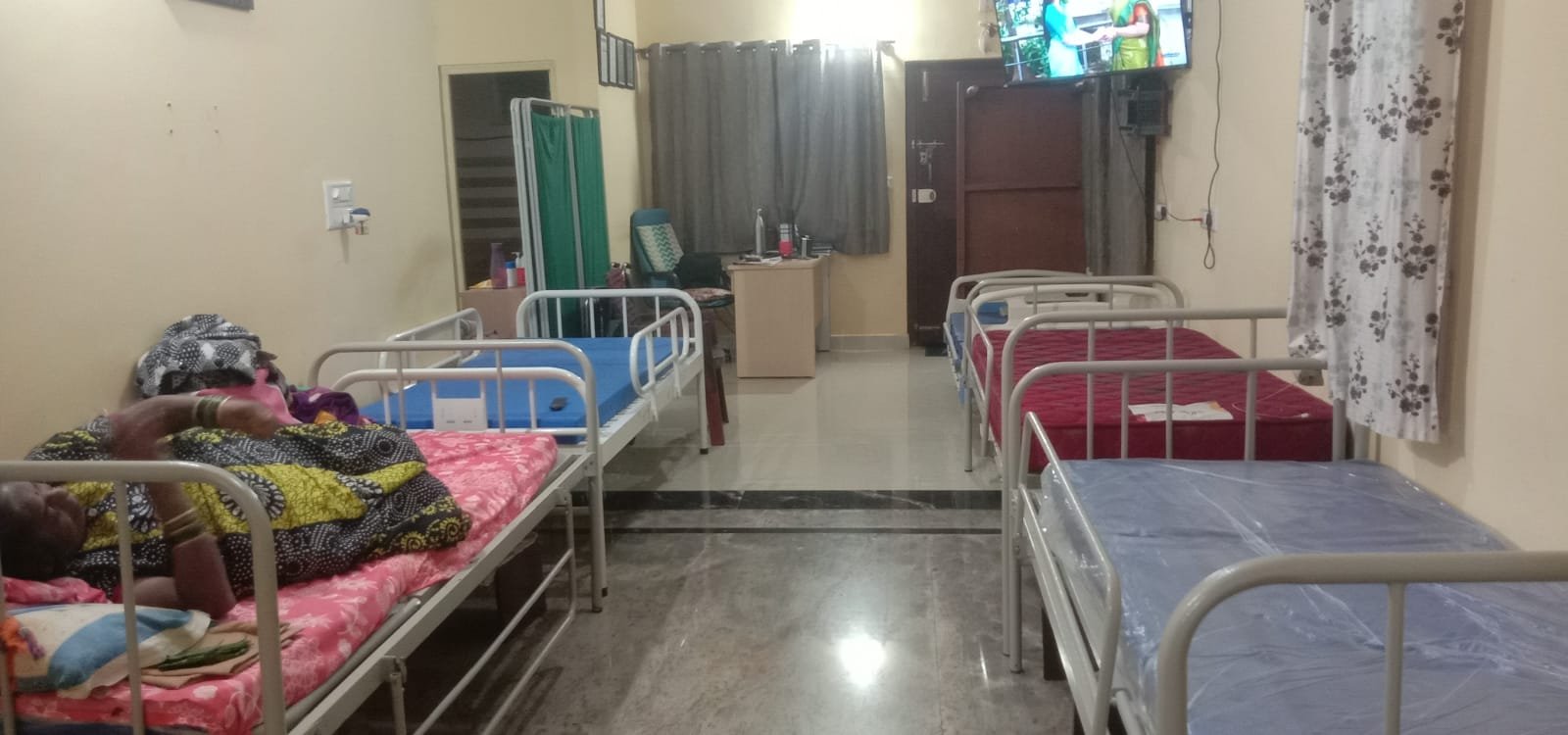 Clean, well-ventilated care ward with monitored beds at Sreekara Health Care Home